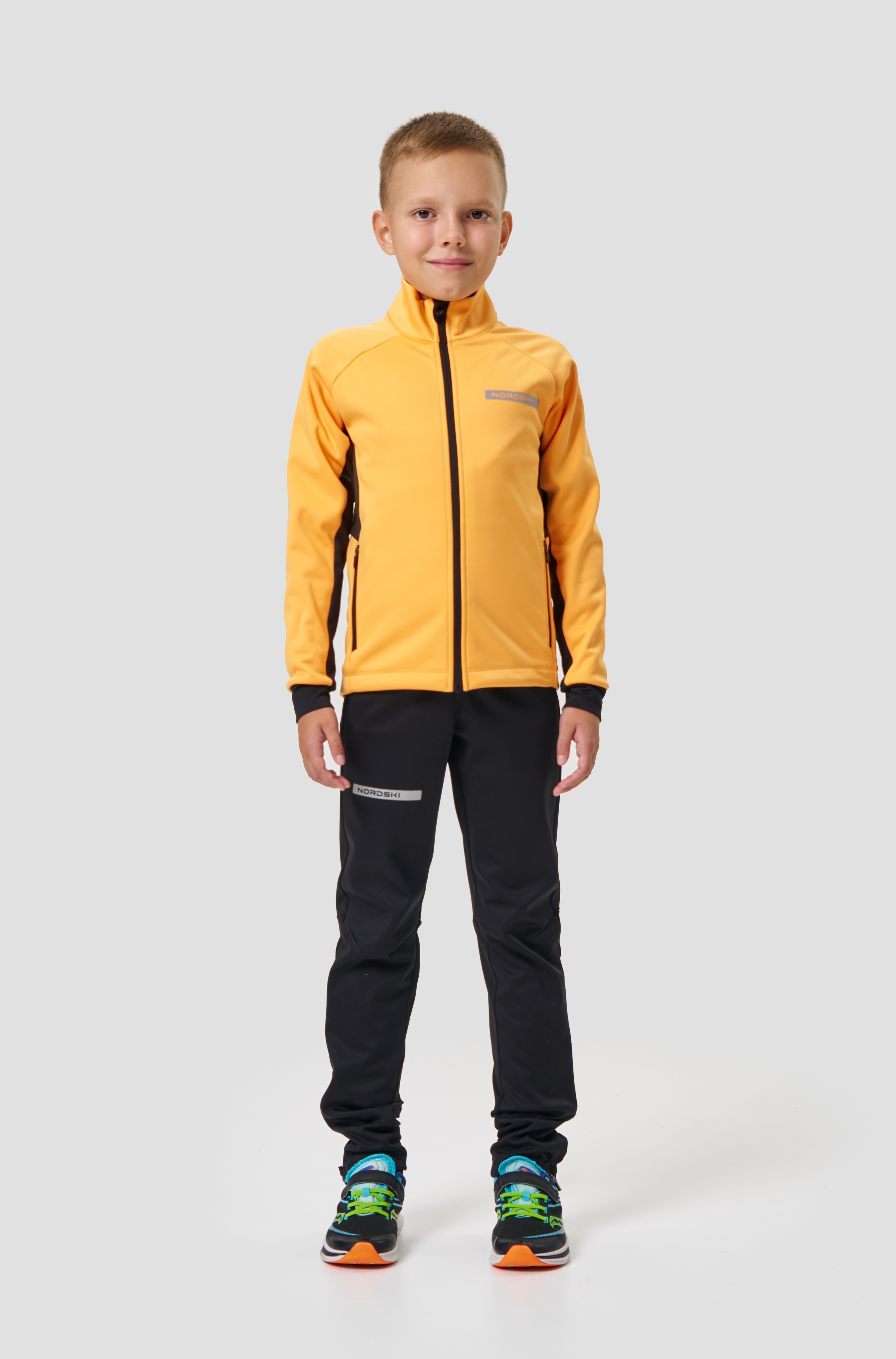 Детский лыжный разминочный костюм Nordski Jr Core orange-black